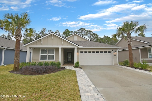 view of front facade featuring a front yard and a garage