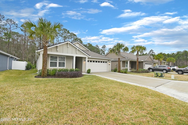 view of front of property featuring a front lawn and a garage