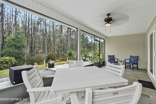 sunroom / solarium with ceiling fan