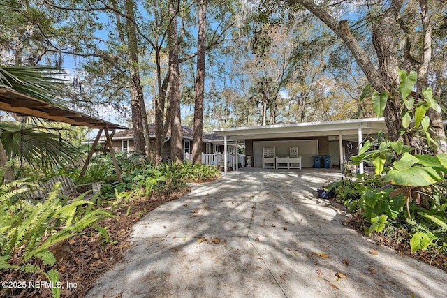 ranch-style house with a carport