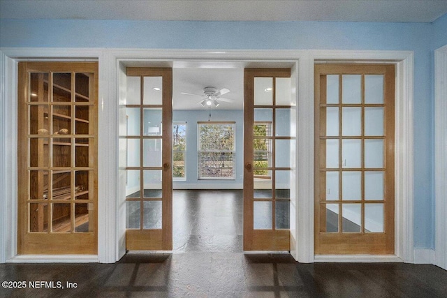 doorway featuring french doors and ceiling fan