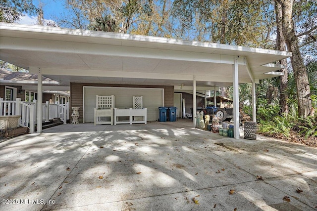 view of patio with a carport and a garage