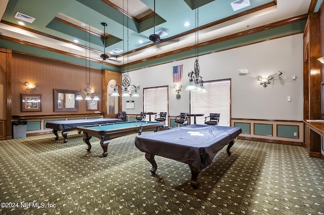 recreation room featuring carpet, a tray ceiling, a towering ceiling, billiards, and ornamental molding