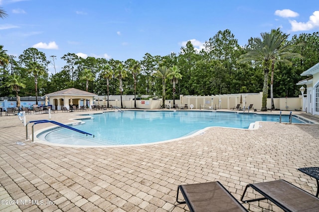 view of swimming pool featuring a patio