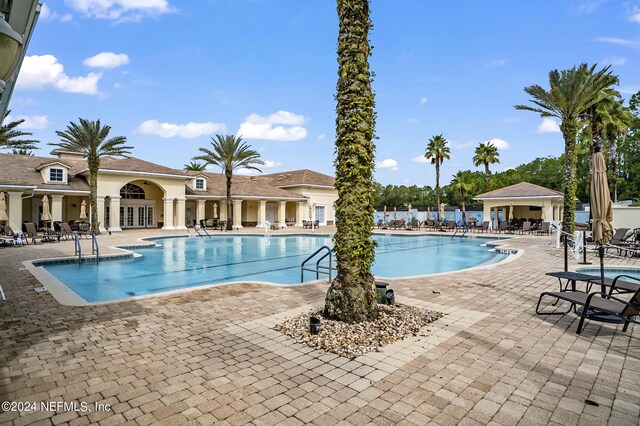 view of swimming pool featuring a patio