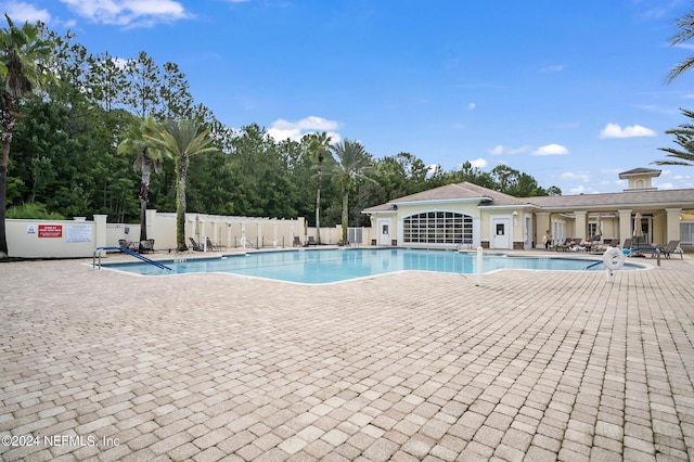 view of swimming pool with a patio area