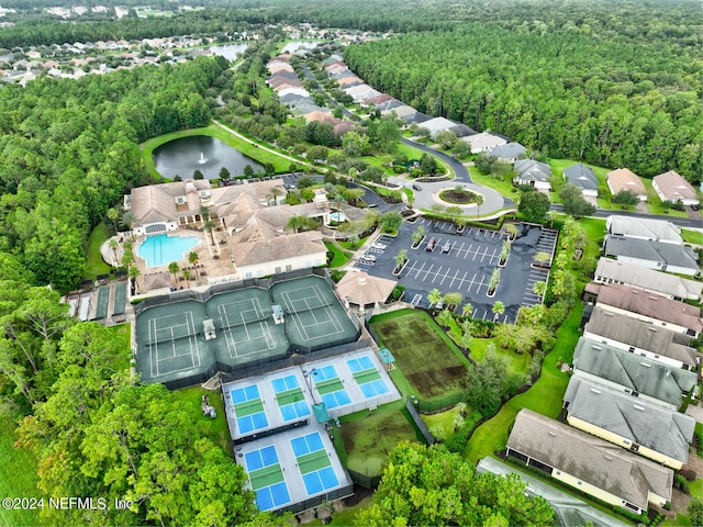 birds eye view of property with a water view