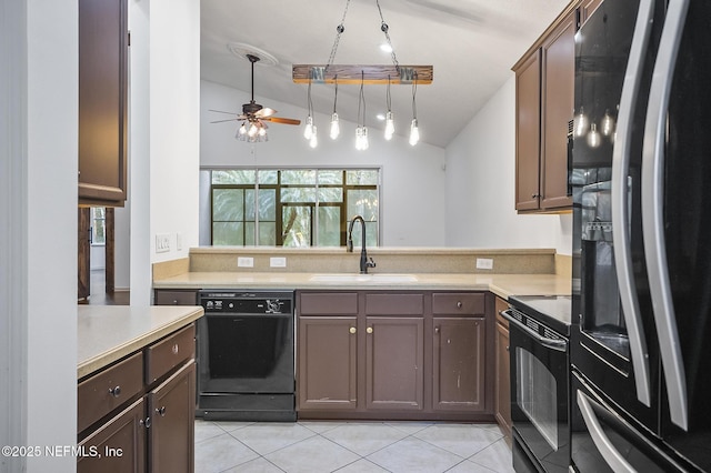 kitchen with black appliances, lofted ceiling, decorative light fixtures, sink, and ceiling fan