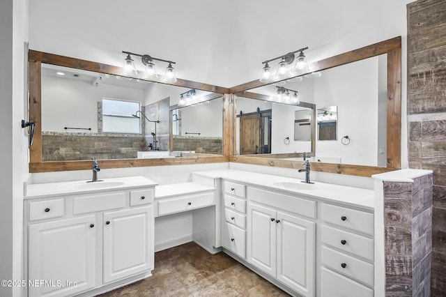 bathroom with vanity and tiled shower