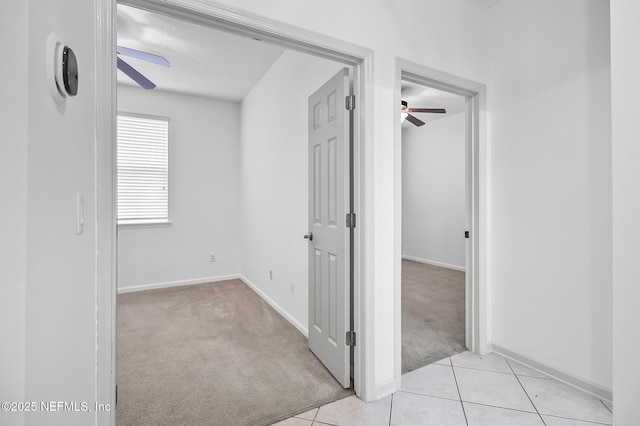 hallway with light carpet