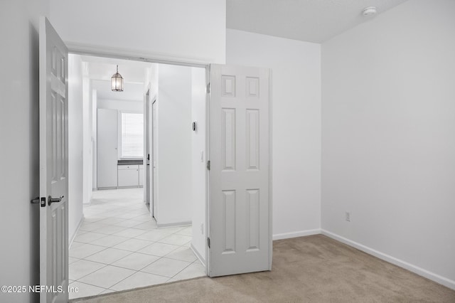 corridor with light colored carpet