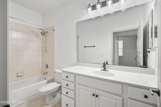 full bathroom with tile patterned floors, toilet, tiled shower / bath combo, and vanity