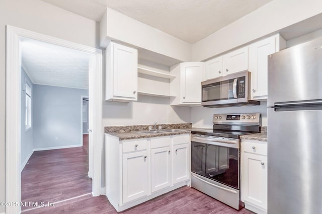 kitchen featuring white cabinetry and stainless steel appliances