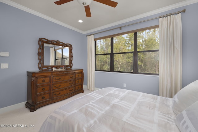 bedroom with crown molding, ceiling fan, and light carpet