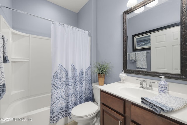 full bathroom with vanity, shower / tub combo, and toilet