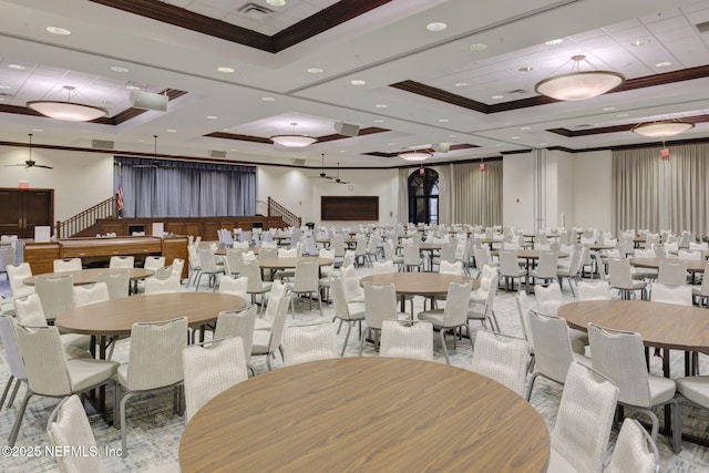 dining area with ornamental molding and a raised ceiling