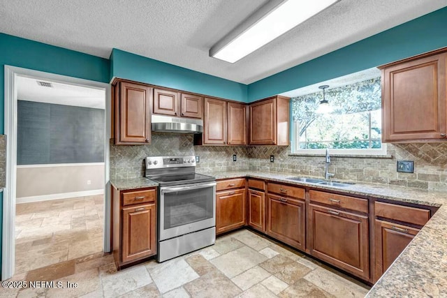 kitchen with hanging light fixtures, stainless steel electric range oven, sink, and a textured ceiling