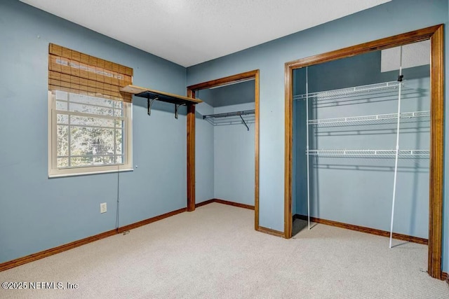 unfurnished bedroom featuring light colored carpet