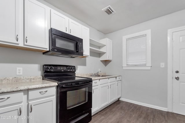 kitchen with black appliances, white cabinetry, dark hardwood / wood-style flooring, sink, and light stone counters