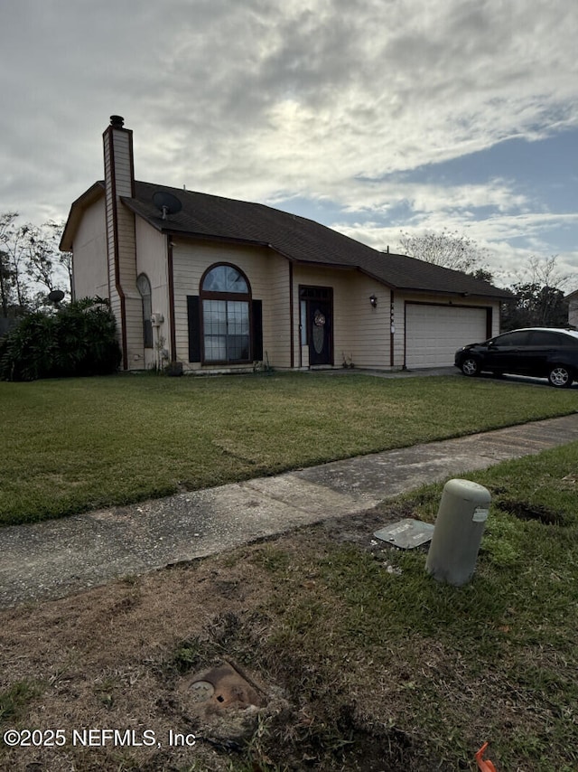 single story home with a garage and a front yard