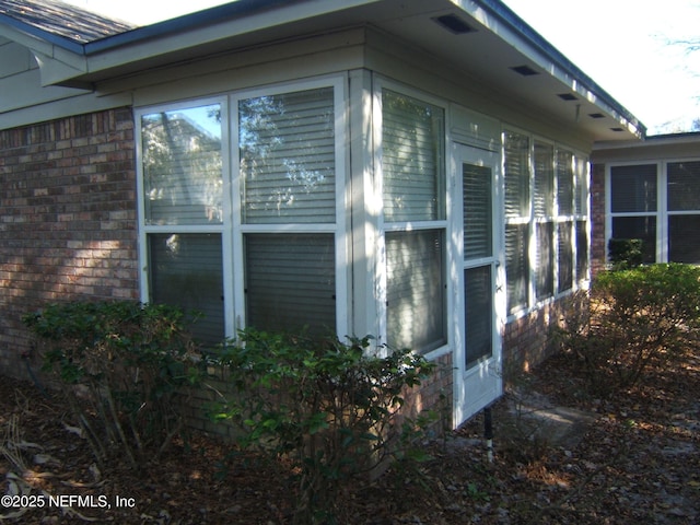 9252 San Jose Blvd Unit 3701, Jacksonville, FL 32257 - view of property exterior featuring a sunroom and brick siding