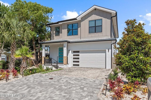 211 Belvedere St, Atlantic Beach, FL 32233 - contemporary home featuring a garage, board and batten siding, a porch, and decorative driveway