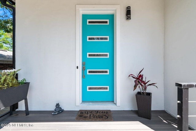 211 Belvedere St, Atlantic Beach, FL 32233 - entrance to property featuring stucco siding