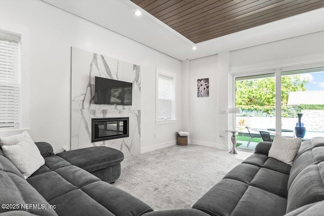 211 Belvedere St, Atlantic Beach, FL 32233 - carpeted living room featuring a high end fireplace, baseboards, wood ceiling, and recessed lighting