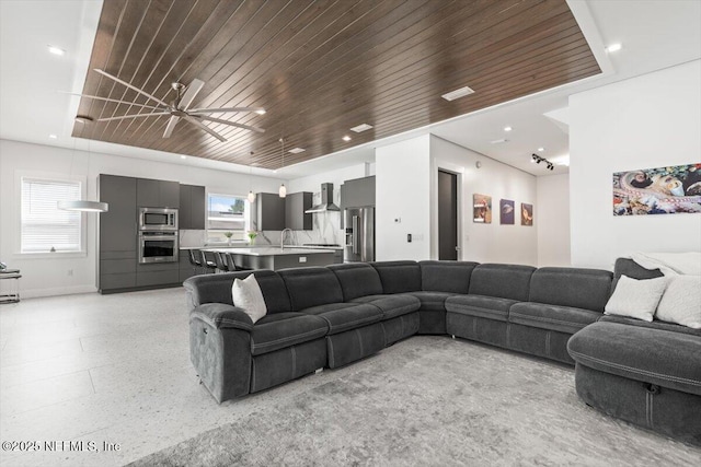 211 Belvedere St, Atlantic Beach, FL 32233 - living room featuring plenty of natural light, wooden ceiling, baseboards, dark aggregate flooring, and recessed lighting