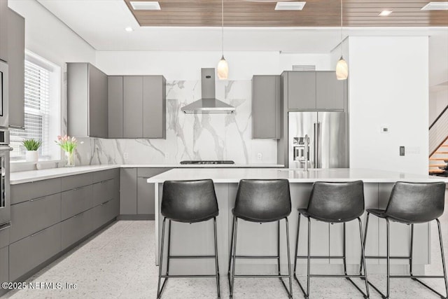 211 Belvedere St, Atlantic Beach, FL 32233 - kitchen featuring gray cabinetry, wall chimney exhaust hood, stainless steel appliances, and recessed lighting