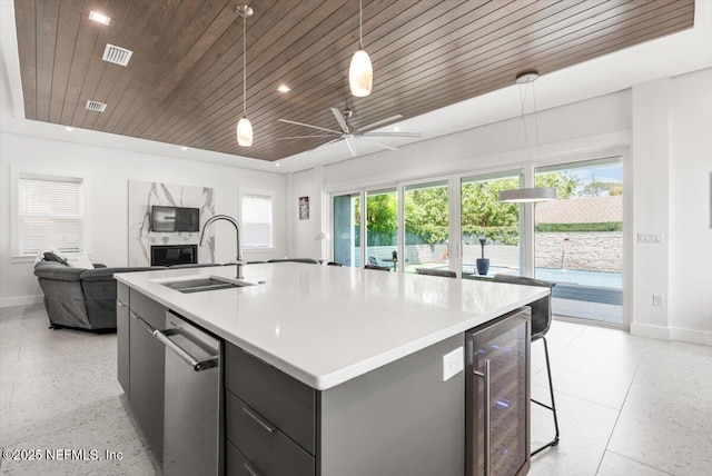 211 Belvedere St, Atlantic Beach, FL 32233 - kitchen with wine cooler, a sink, open floor plan, baseboards, and wooden ceiling
