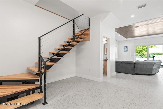 211 Belvedere St, Atlantic Beach, FL 32233 - stairway featuring baseboards, recessed lighting, and speckled floor