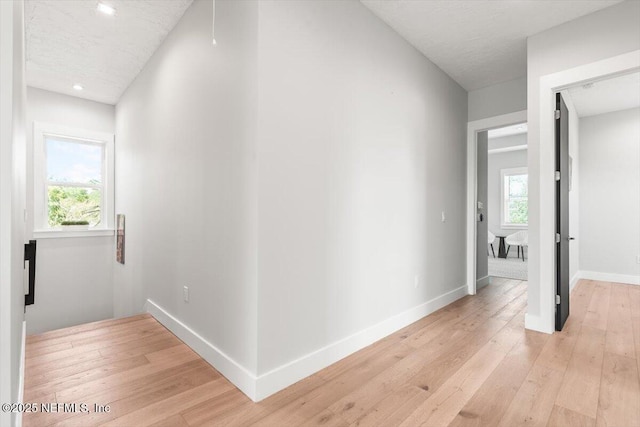 211 Belvedere St, Atlantic Beach, FL 32233 - corridor featuring light wood finished floors, baseboards, and recessed lighting