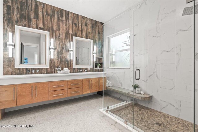 211 Belvedere St, Atlantic Beach, FL 32233 - full bath with a marble finish shower, double vanity, and speckle patterned floor