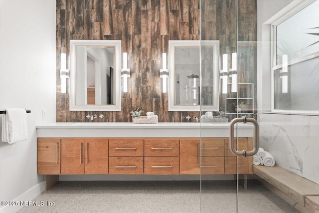 211 Belvedere St, Atlantic Beach, FL 32233 - bathroom featuring double vanity, baseboards, and speckled floor