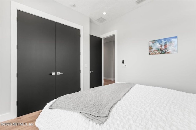 211 Belvedere St, Atlantic Beach, FL 32233 - bedroom with a closet and light wood-style floors