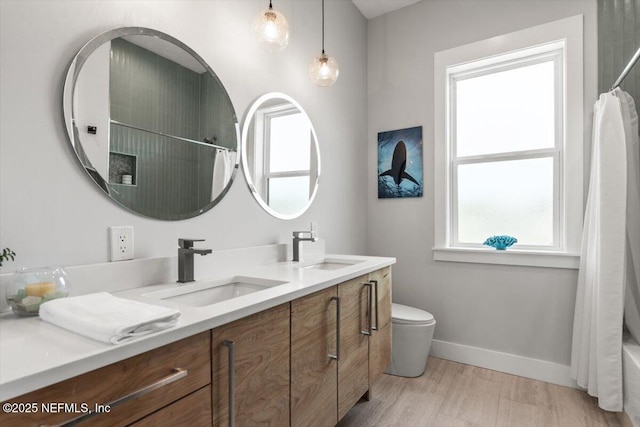 211 Belvedere St, Atlantic Beach, FL 32233 - full bathroom with double vanity, baseboards, toilet, and shower / bath combo