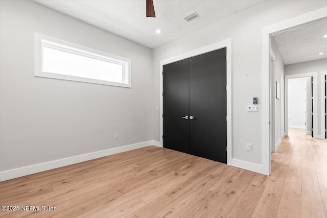 211 Belvedere St, Atlantic Beach, FL 32233 - unfurnished bedroom with a closet, light wood-style floors, baseboards, recessed lighting, and ceiling fan