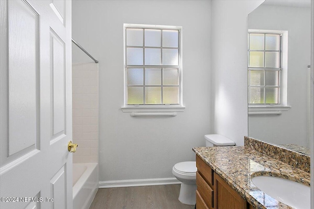 full bathroom with toilet, vanity, shower / washtub combination, and hardwood / wood-style flooring