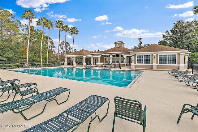 view of swimming pool with a patio