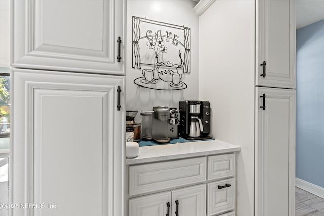 bar with white cabinetry