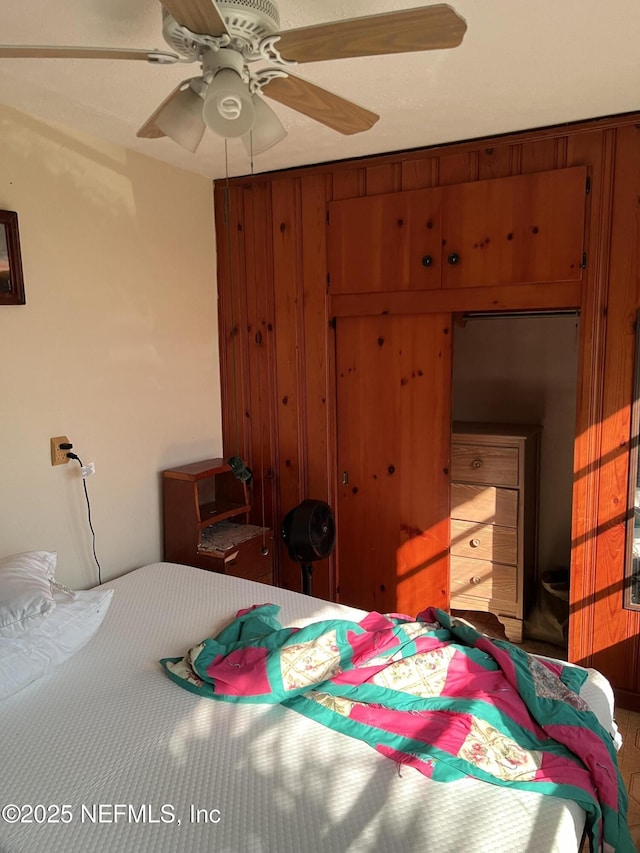 bedroom with a closet and ceiling fan