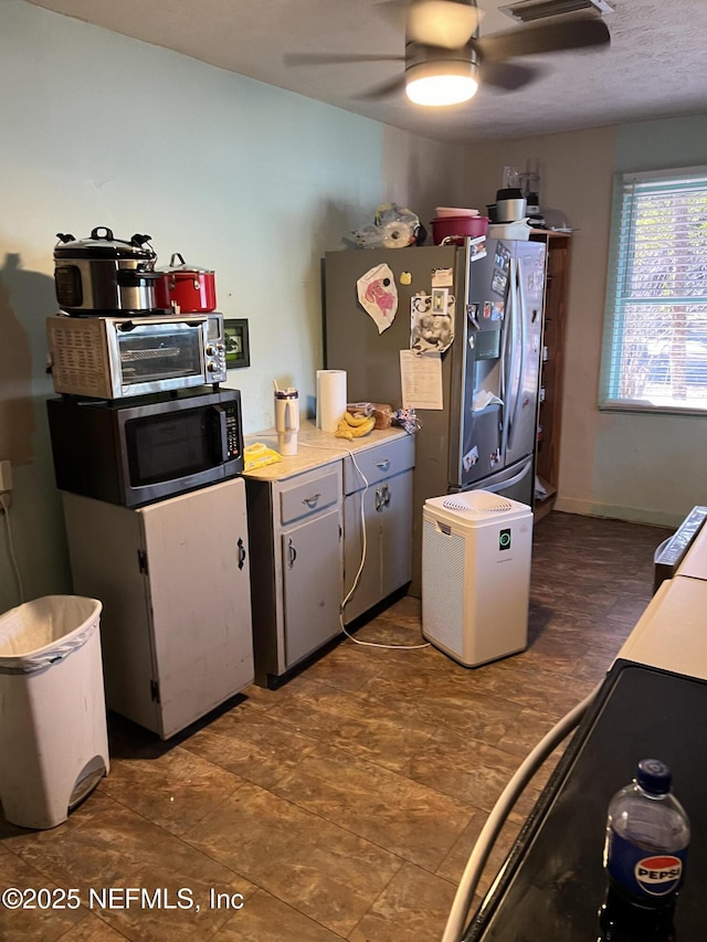 kitchen featuring stainless steel appliances and ceiling fan