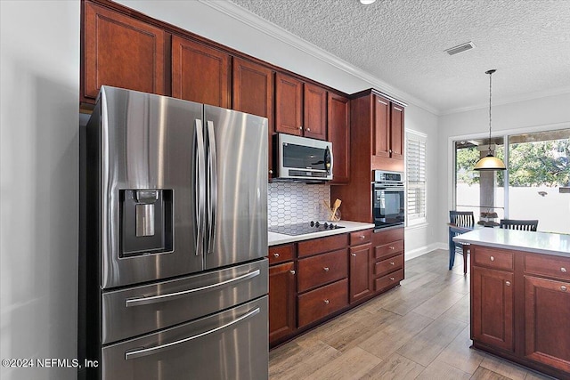 kitchen with stainless steel appliances, tasteful backsplash, pendant lighting, a textured ceiling, and crown molding