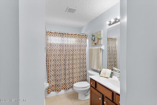 full bathroom featuring a textured ceiling, tile patterned flooring, vanity, toilet, and shower / tub combo with curtain