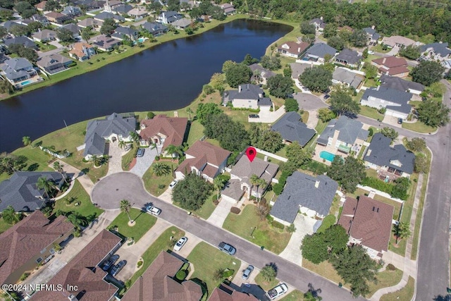 bird's eye view with a water view