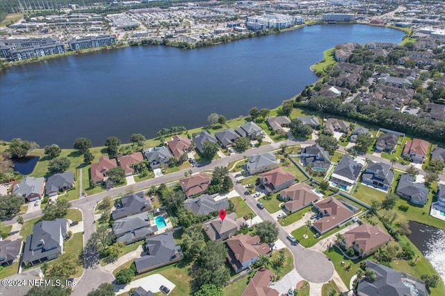 birds eye view of property with a water view