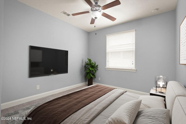 bedroom with ceiling fan and carpet