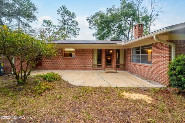 rear view of property with a patio