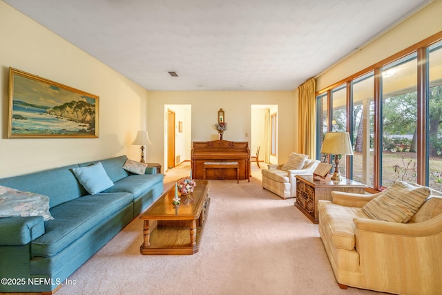 living room featuring light carpet